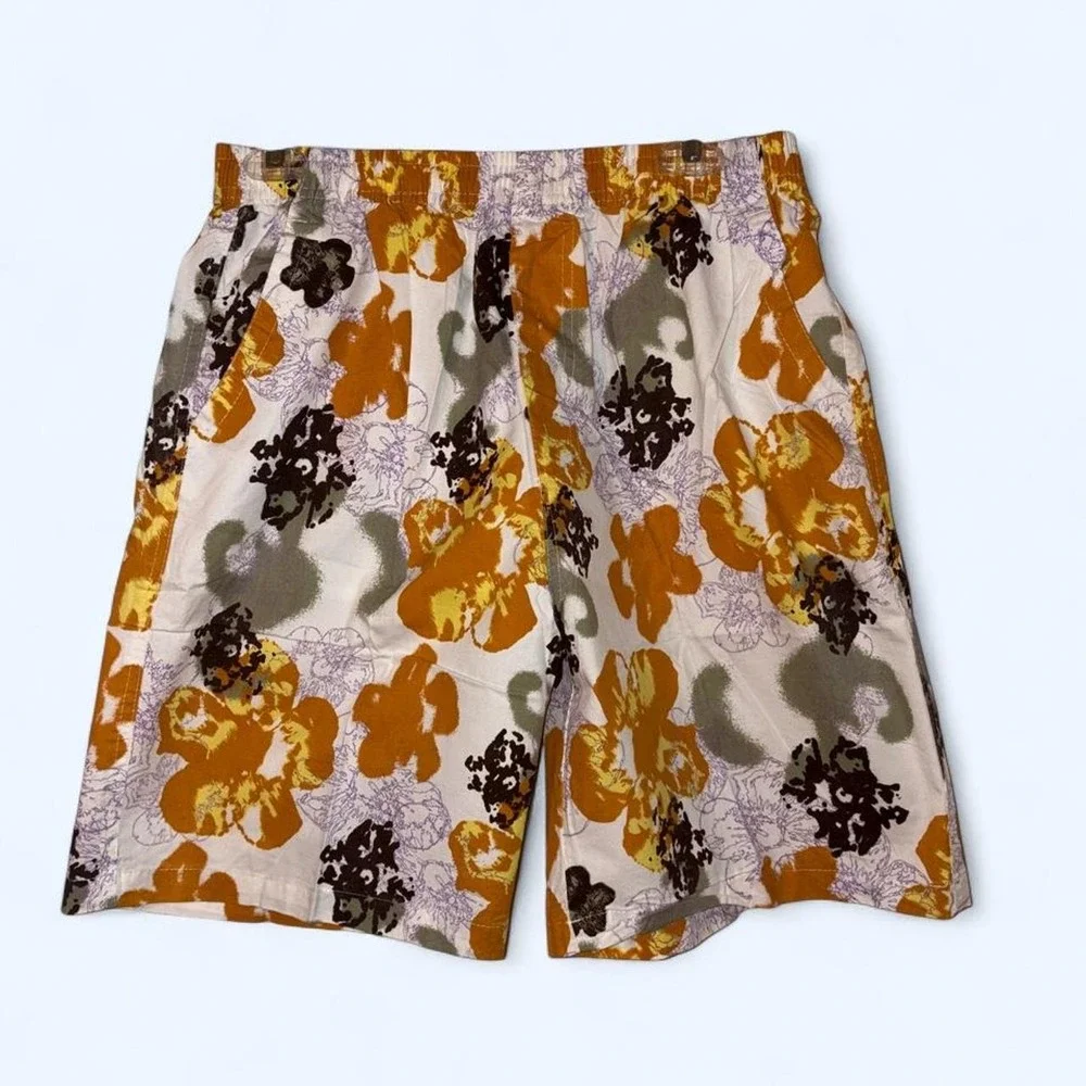 Swim Shorts Orange, black, and purple floral print swim trunks #swimwear #floral
